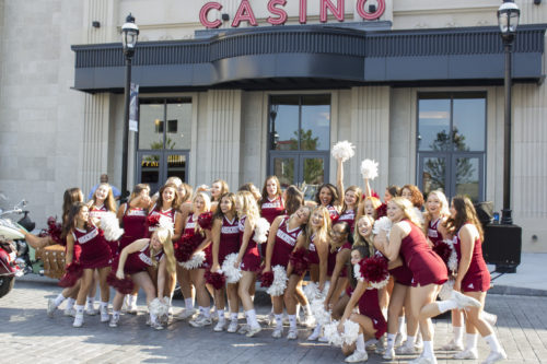 The University of Massachusetts cheerleading team getting ready for MGM Springfield's opening day parade