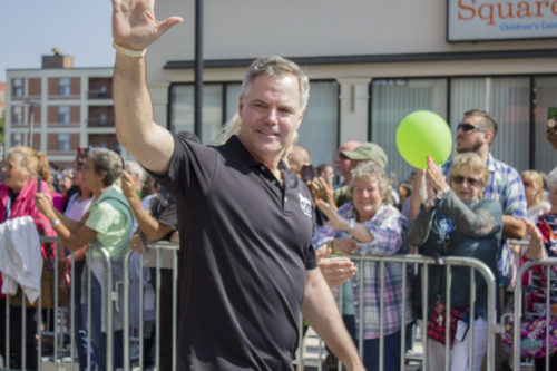 MGM Resorts International Chief Executive Officer Jim Murren waves to the crowd during the MGM Springfield grand opening parade