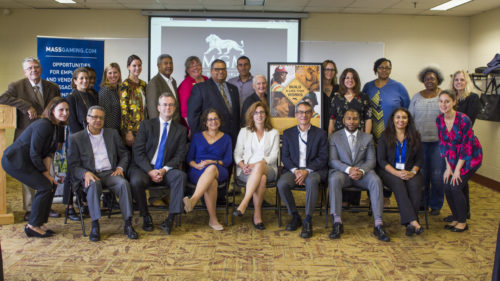 Members of the Access and Opportunity Committee pose with a "Build A Life That Works" poster at MGM Springfield's close-out meeting, October 9, 2018