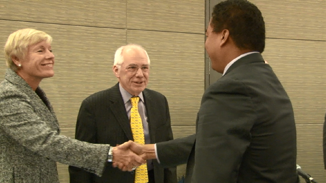 Commission shakes hands with Mike Mathis