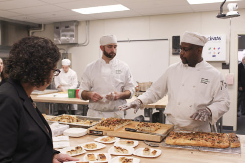 MGC Director of Supplier, Workforce, and Diversity Development Jill Griffin views some of the creations by HCC MGM Culinary Arts Institute Students